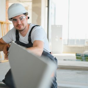 Male,Construction,Worker,Wearing,Uniform,Install,Gypsum,Ceiling,Inside,The
